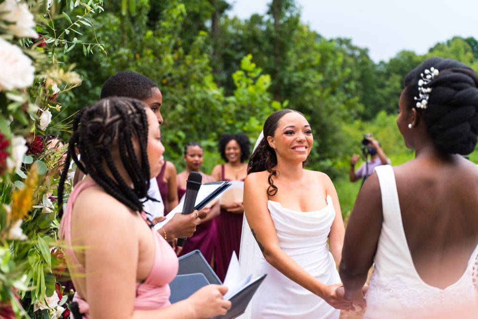 the author looking at her wife during their wedding ceremony