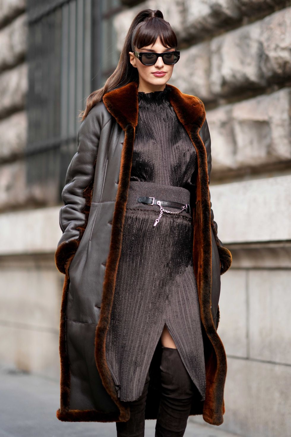 woman wearing long shearling coat