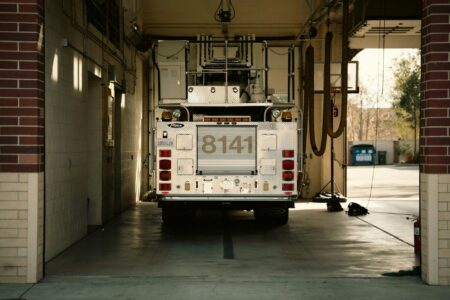 Interior view of fire station with trucks and equipment bays