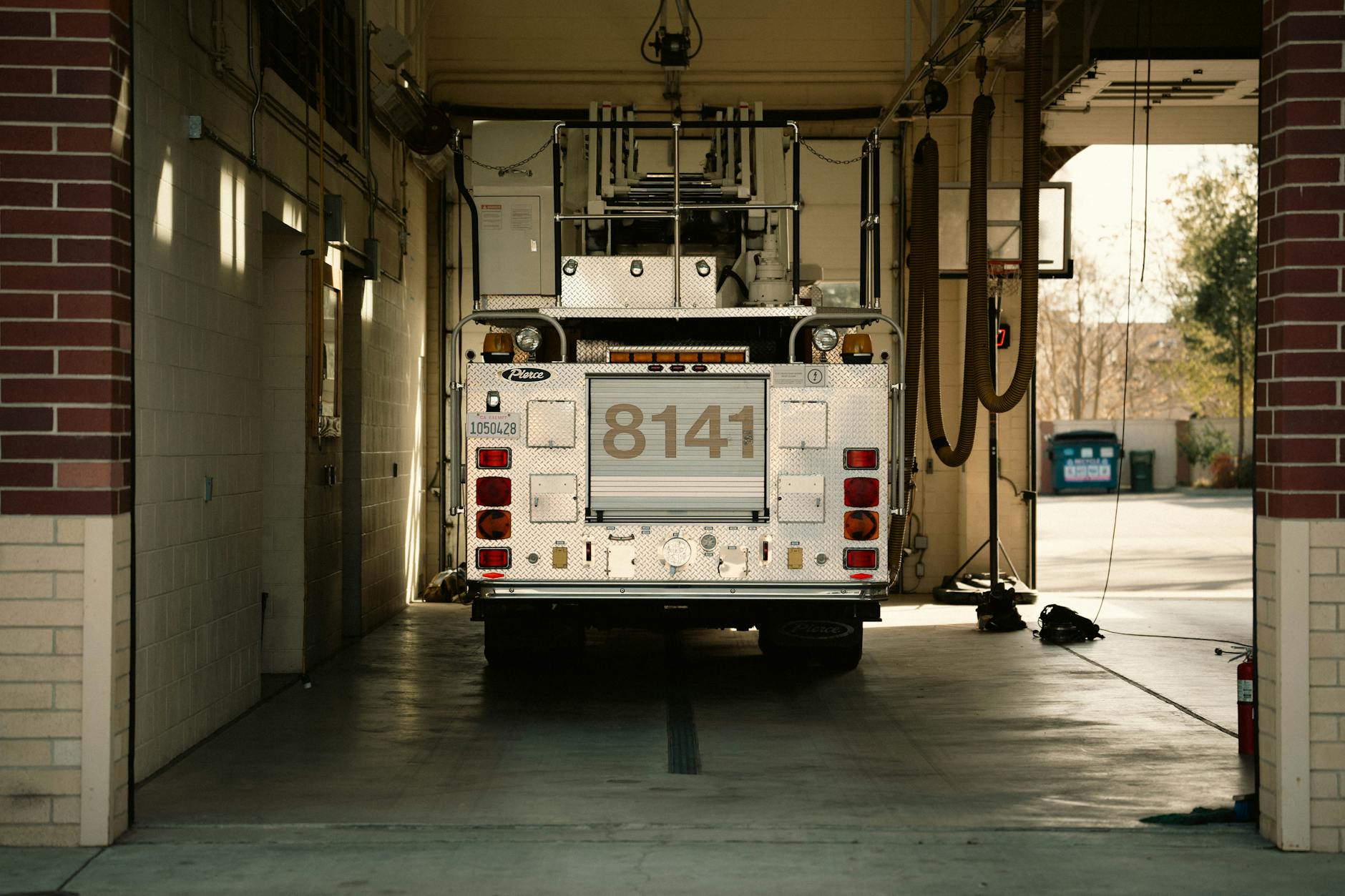 Interior view of fire station with trucks and equipment bays