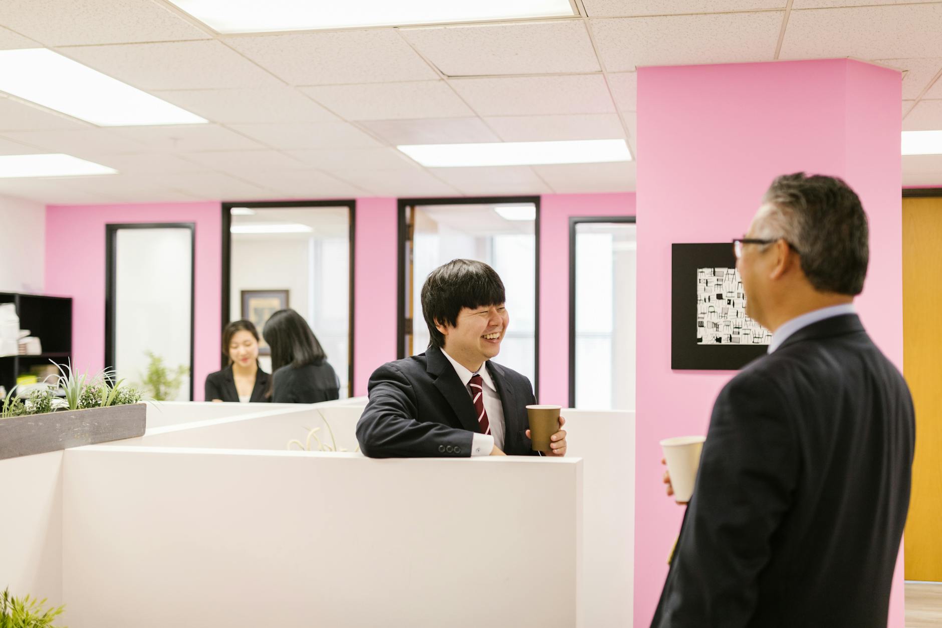 Modern office environment with professionals in business casual attire