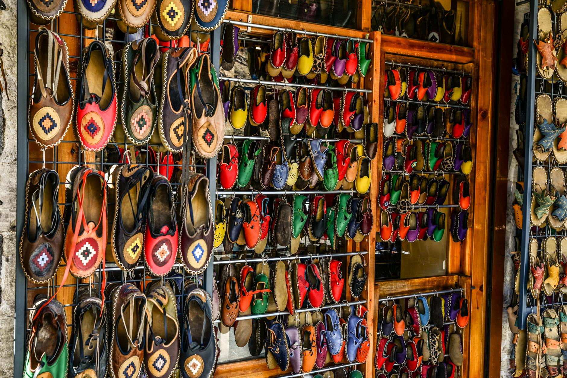 Display of various colorful casual shoes showing fashion footwear variety