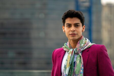 Colorful silk scarf draped elegantly showing the luxurious texture and vibrant patterns typical of high-end designer accessories