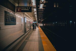 Modern subway platform with architectural lighting and tiled walls suitable for fashion shows
