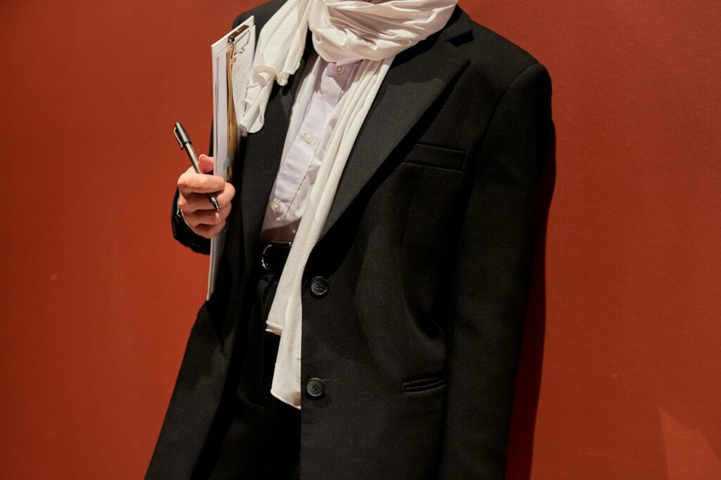 How Oversized Blazers Became the New Uniform for Creative Directors Professional woman wearing structured oversized blazer in modern office setting