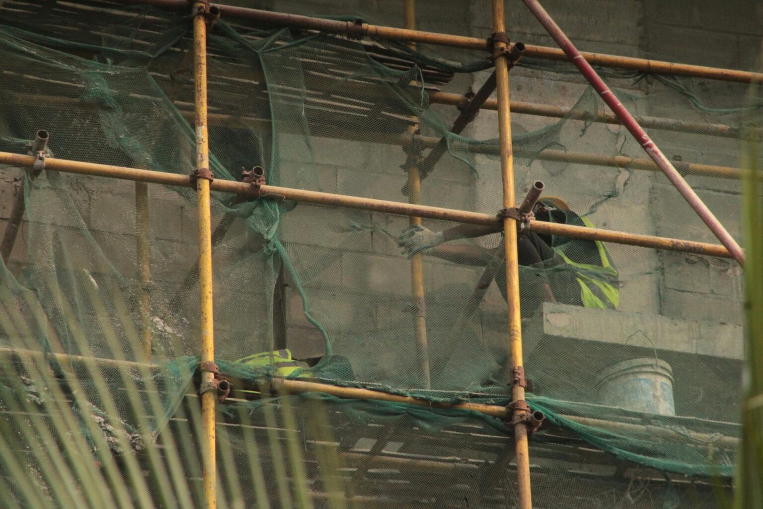 Construction site with scaffolding and building materials creating an industrial backdrop
