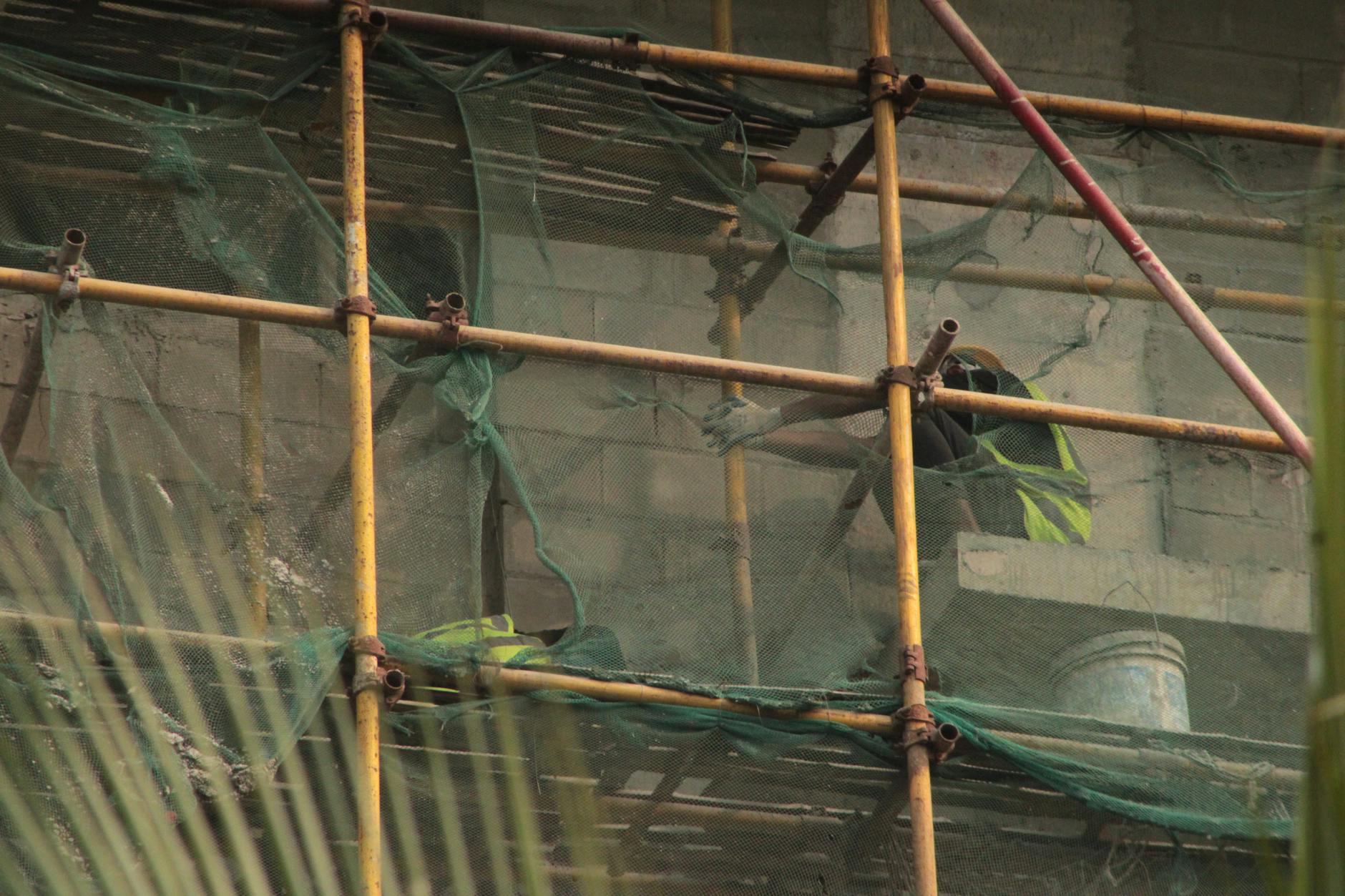 Construction site with scaffolding and building materials creating an industrial backdrop