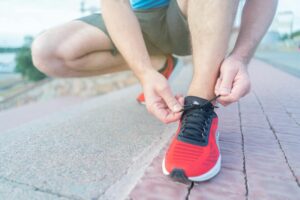 Why Podiatrists Are Designing Custom Insoles for Marathon Runners Close-up view of athletic running shoes showing insole and foot support technology