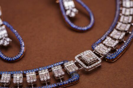How Vintage Chanel Brooches Became Silicon Valley’s New Status Symbol Close-up of elegant vintage jewelry pieces displayed on dark velvet surface