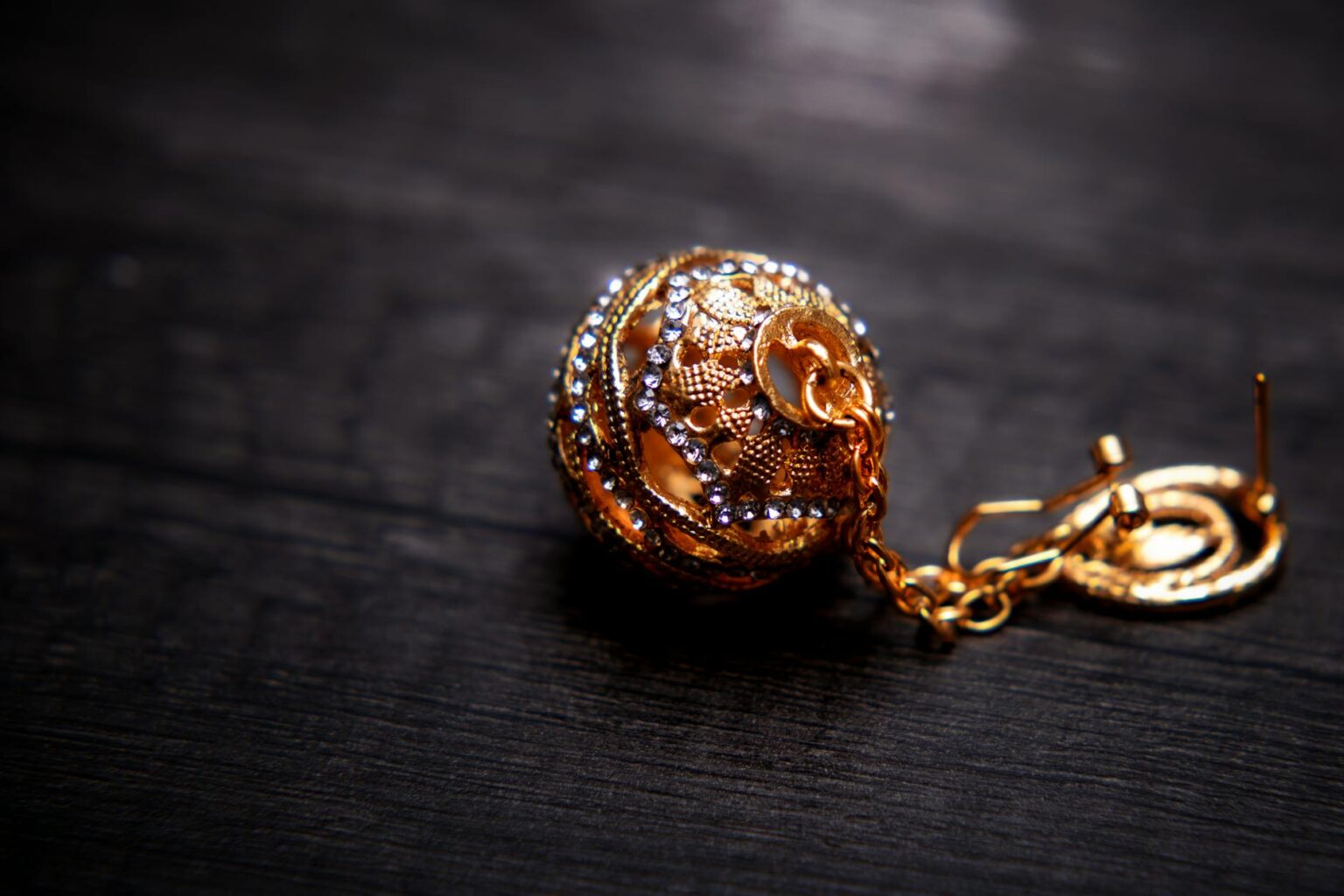 Close-up of elegant statement earrings against neutral background showcasing minimalist jewelry trend