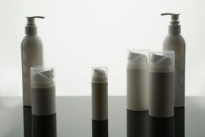 Multiple skincare products arranged on clean surface showing layering routine essentials