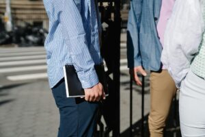 Professional casual clothing hanging in modern office wardrobe