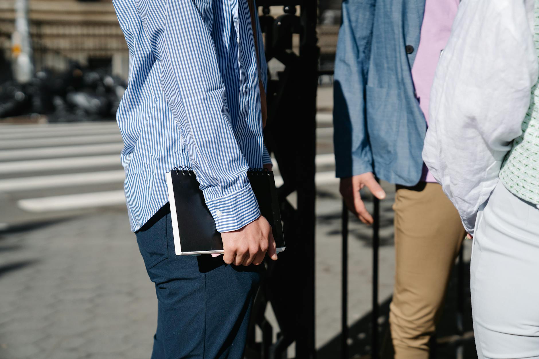 Professional casual clothing hanging in modern office wardrobe