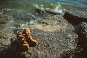 Professional woman wearing hiking boots in modern office setting
