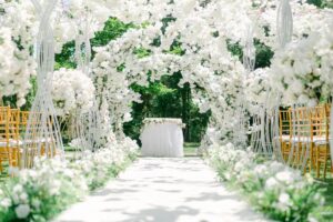 Elegant white wedding dress hanging in vintage boutique setting