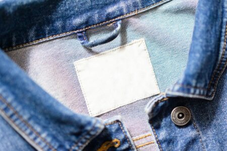 Close-up of a vintage denim jacket showing detailed stitching and texture