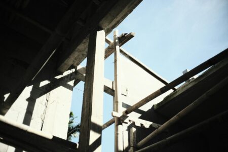 Industrial construction site with steel scaffolding and building framework