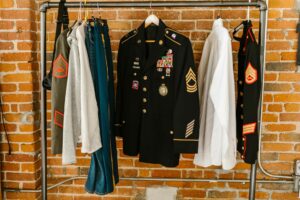 How Military Surplus Jackets Became Luxury Fashion’s Latest Obsession Olive green military style jacket hanging on clothing rack
