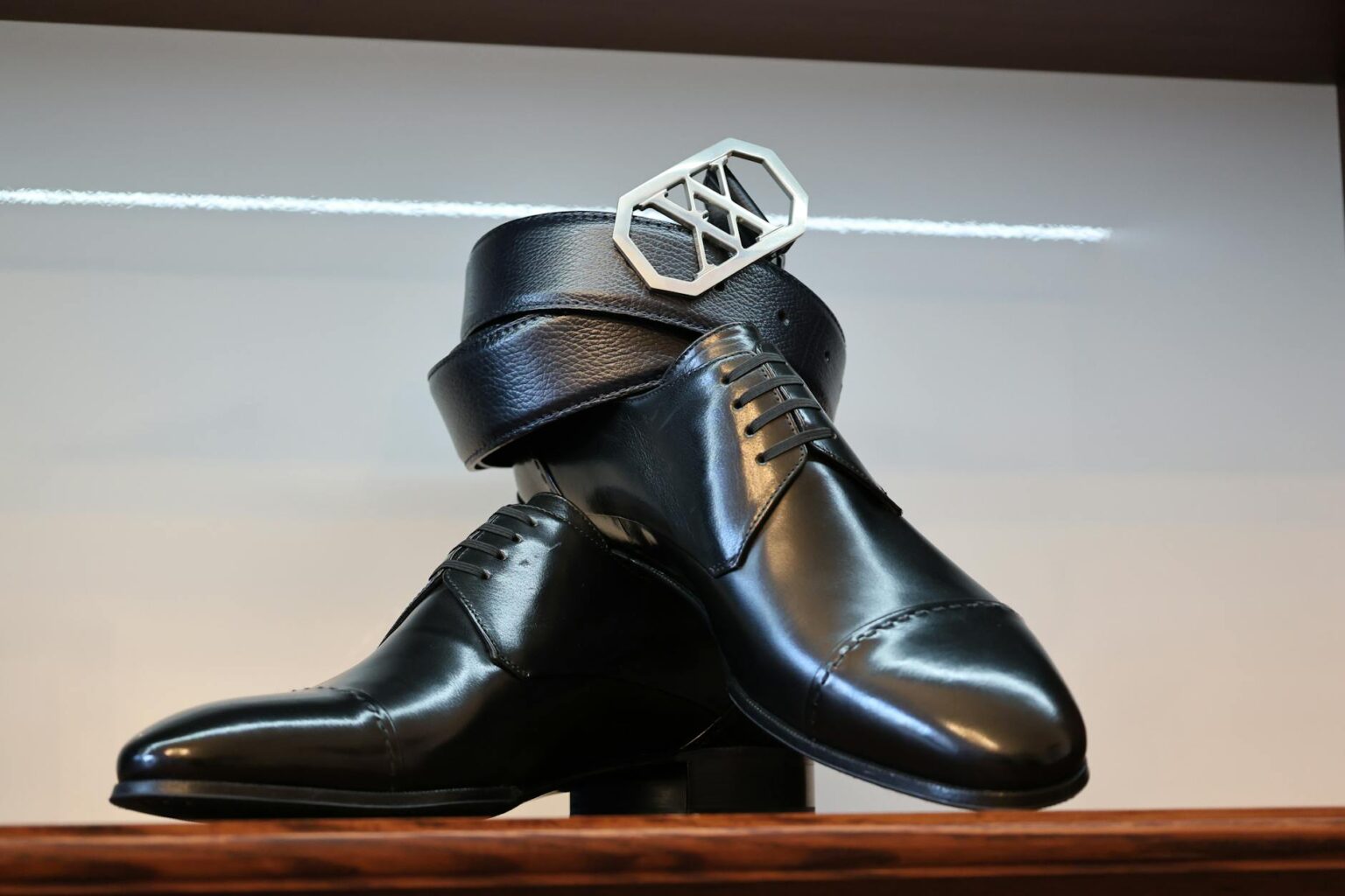 High-end designer shoes displayed on elegant surface showing craftsmanship and style