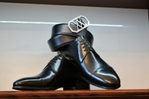 High-end designer shoes displayed on elegant surface showing craftsmanship and style