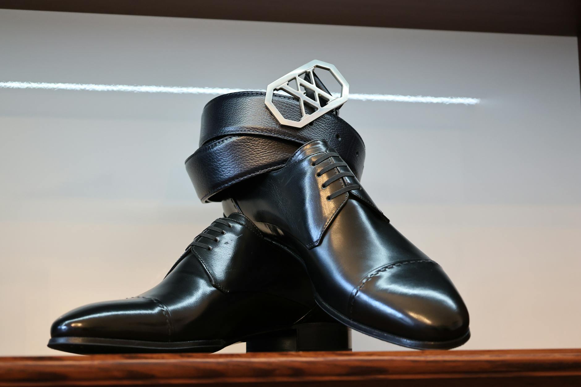 High-end designer shoes displayed on elegant surface showing craftsmanship and style