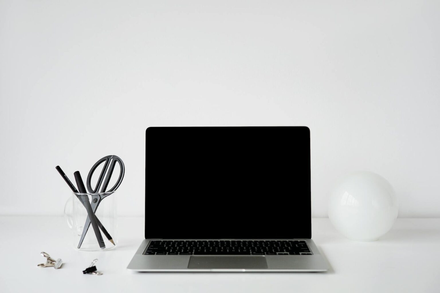 Why Wealthy Millennials Are Hiring Professional Organizers for Digital Decluttering Person organizing digital files on laptop computer with clean workspace