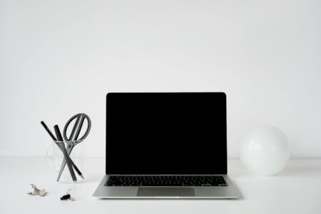 Why Wealthy Millennials Are Hiring Professional Organizers for Digital Decluttering Person organizing digital files on laptop computer with clean workspace