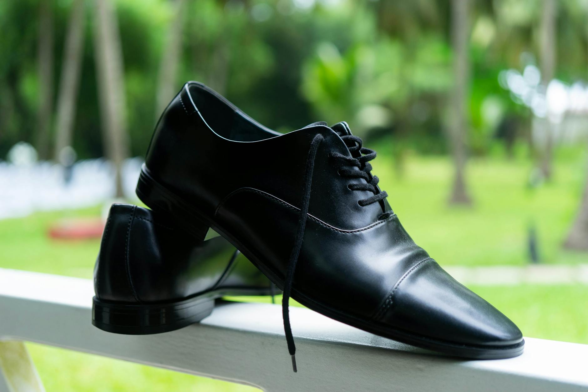 Close-up of professional black leather clogs with ergonomic design suitable for business wear