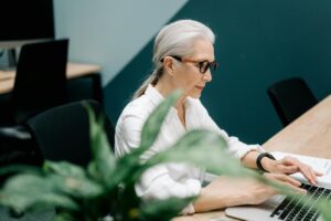 Professional businesswoman in office setting wearing comfortable flat shoes