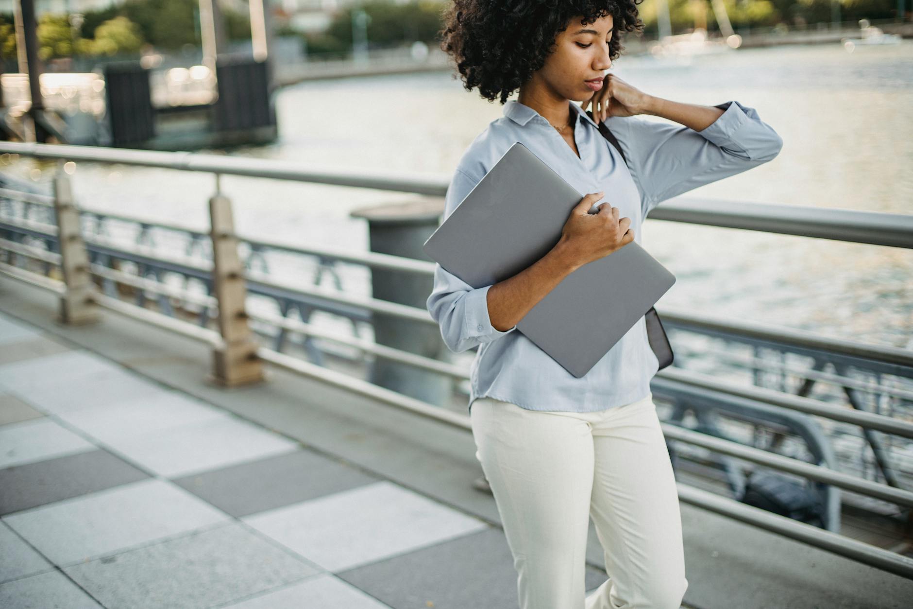 Professional woman walking confidently in office attire and comfortable shoes