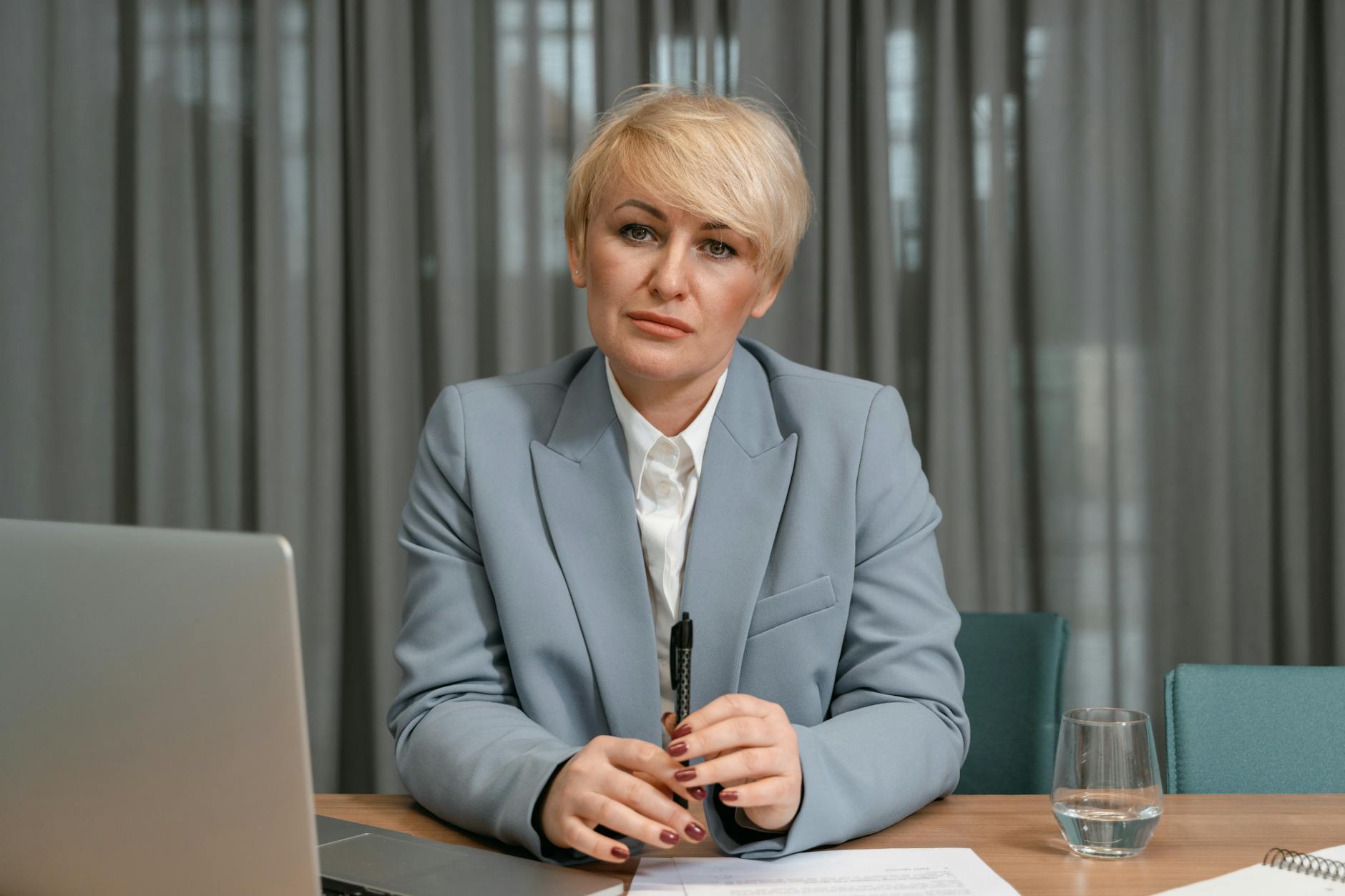 Professional woman in business attire demonstrating confident appearance