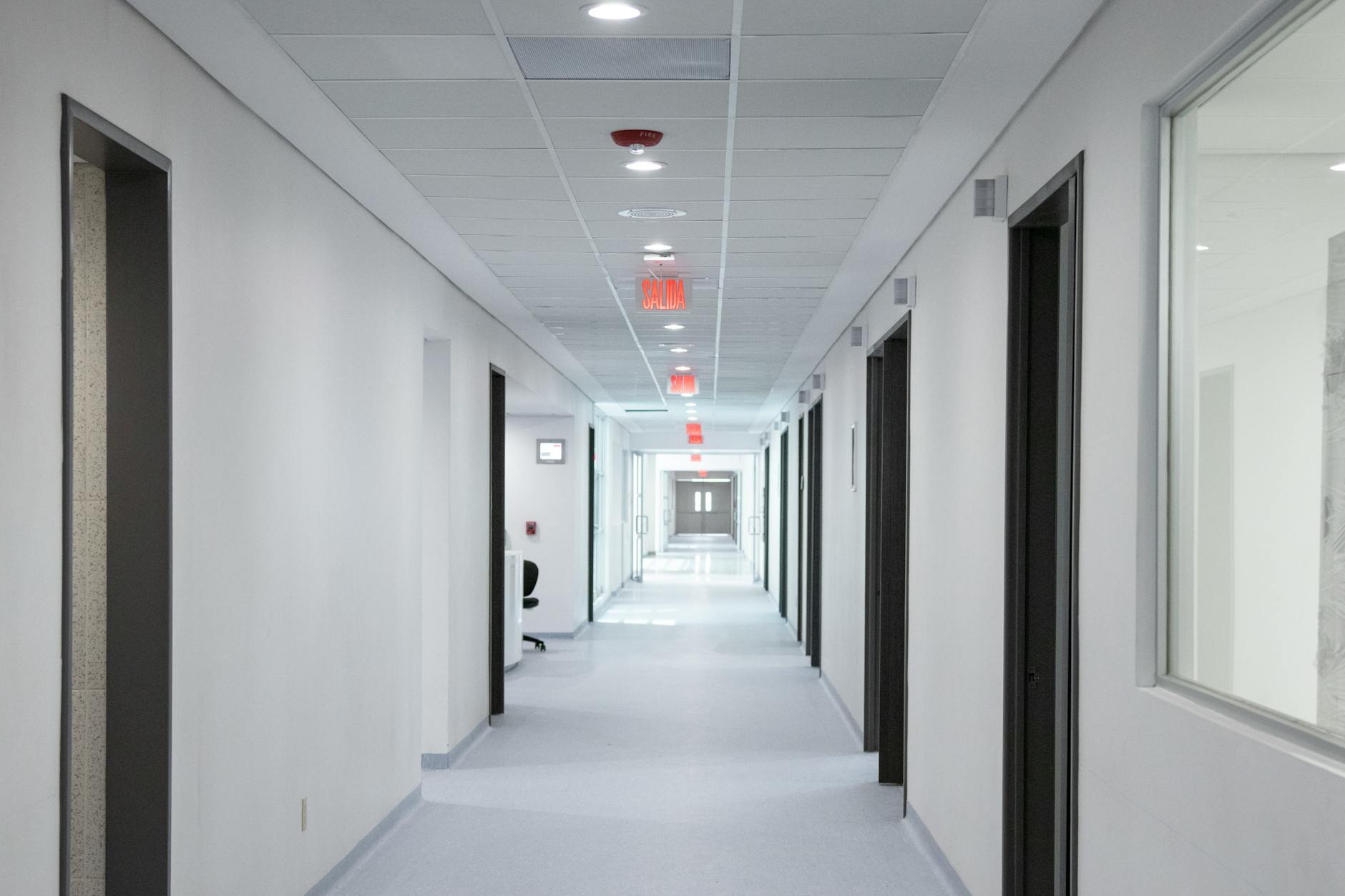 Modern hospital hallway with polished floors highlighting the professional healthcare environment
