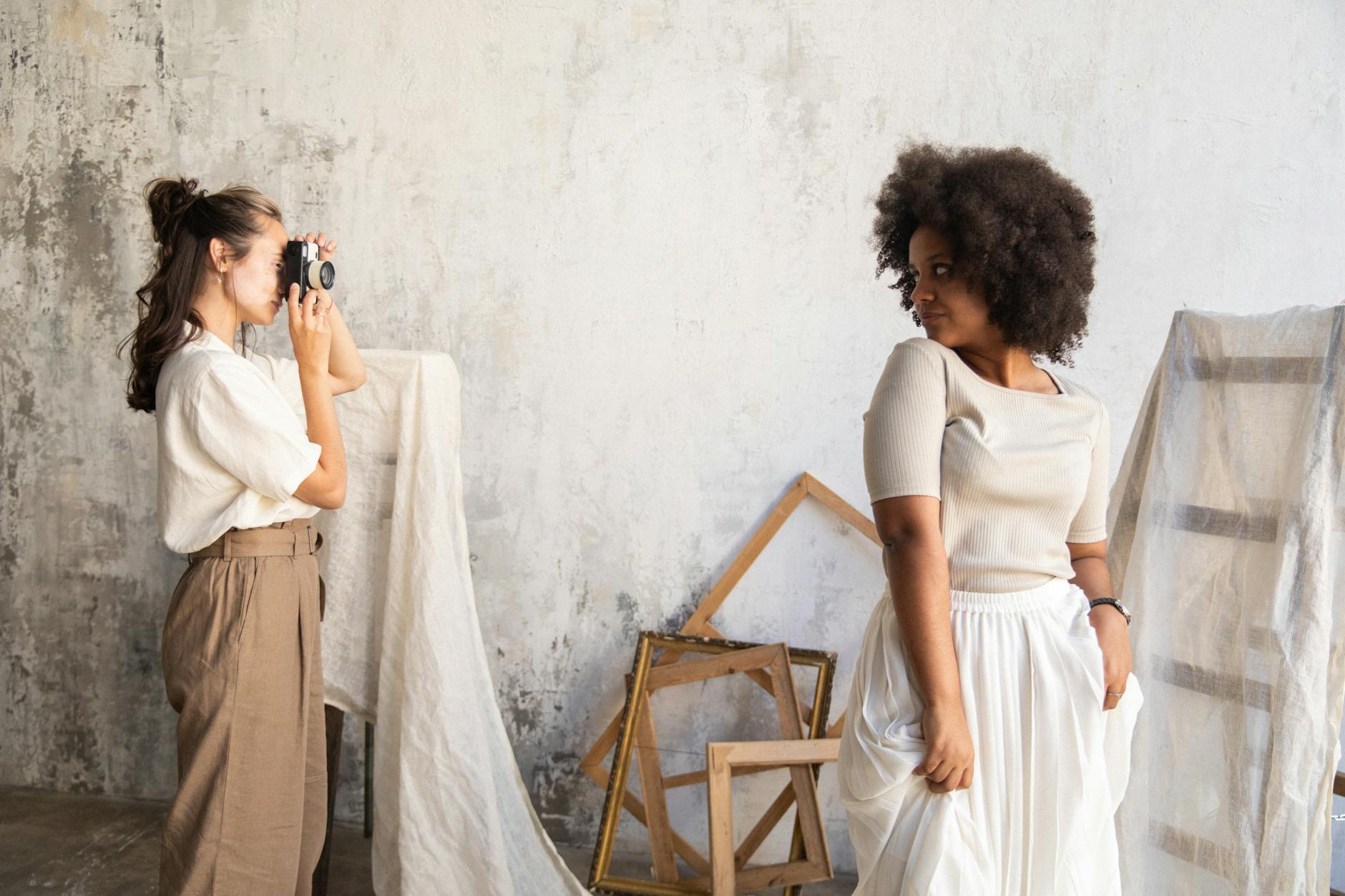 Professional photographer taking pictures at outdoor fashion event with camera equipment