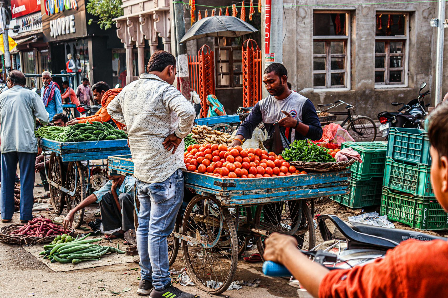 Vibrant street market scene with colorful displays of fresh fruits and vegetables