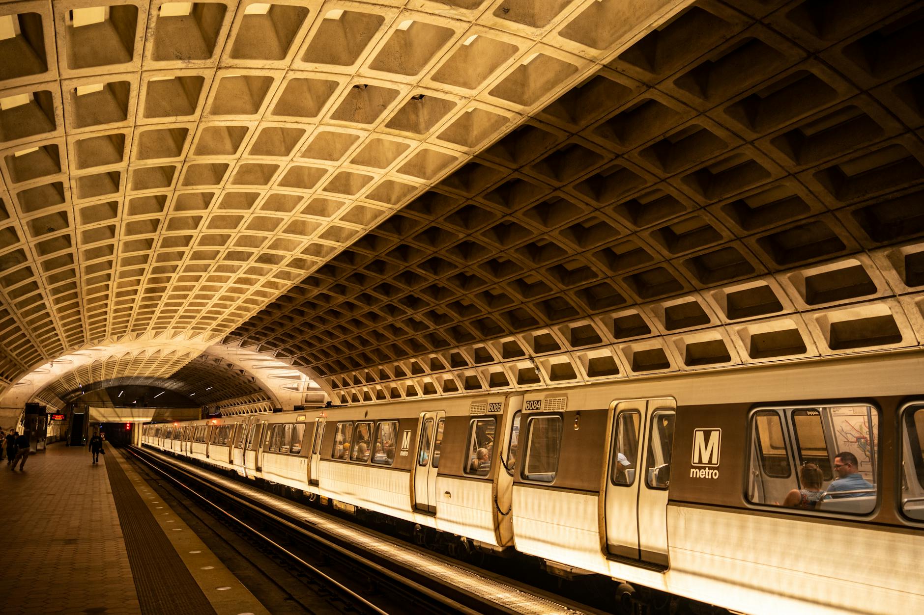 Sleek metro train arriving at an urban subway station platform