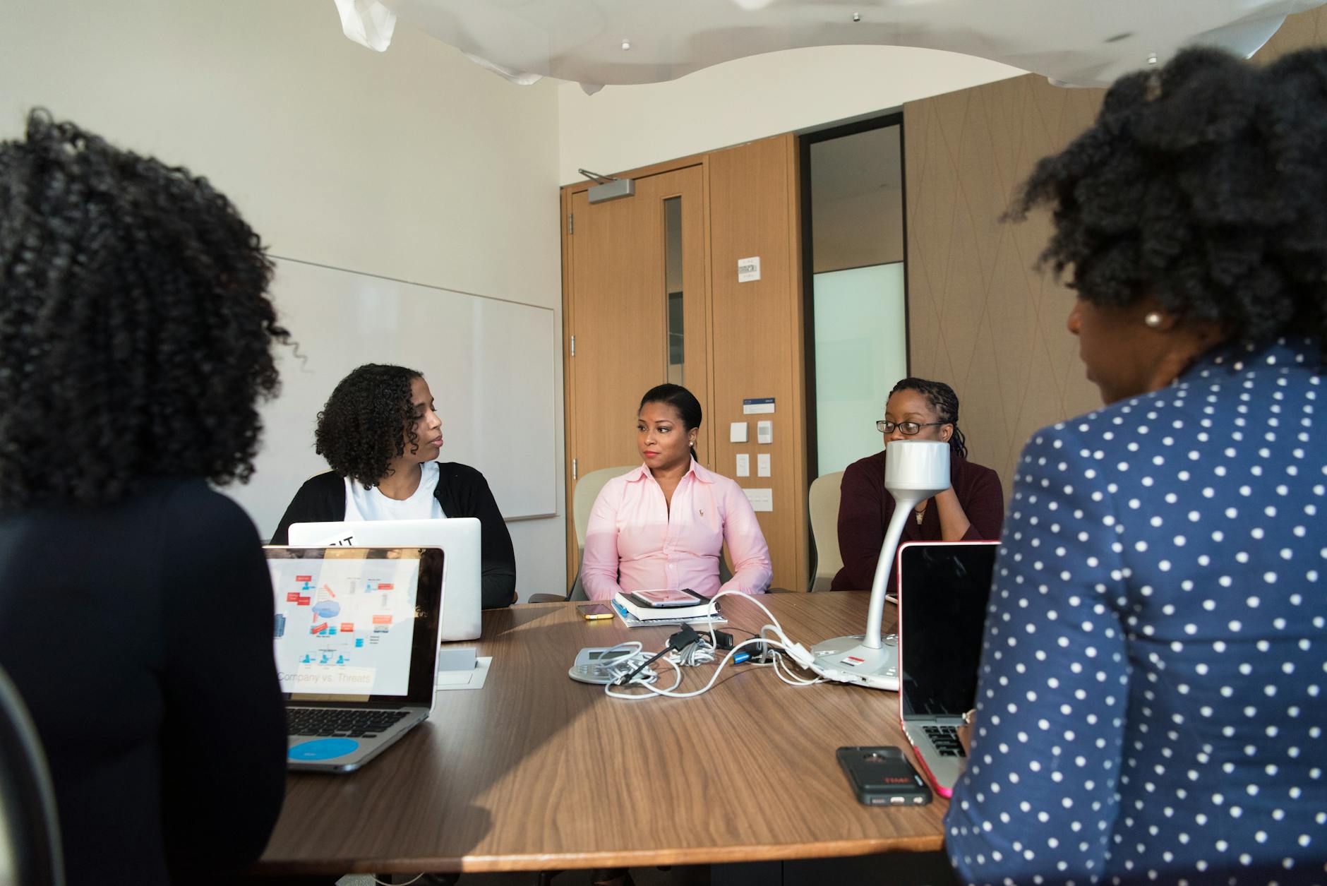 Professional business meeting in modern conference room setting