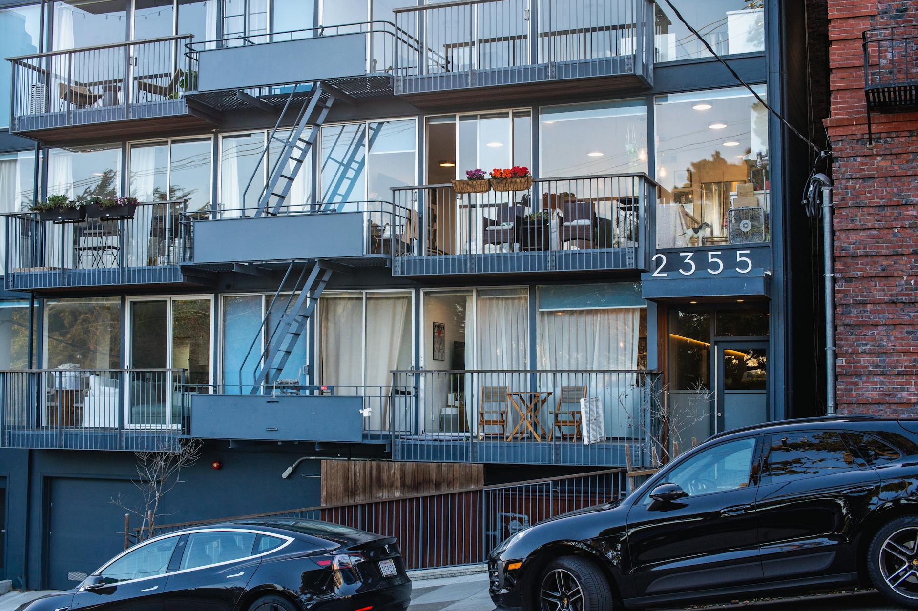 Sleek minimalist living space with carefully curated furnishings and clean organizational systems
