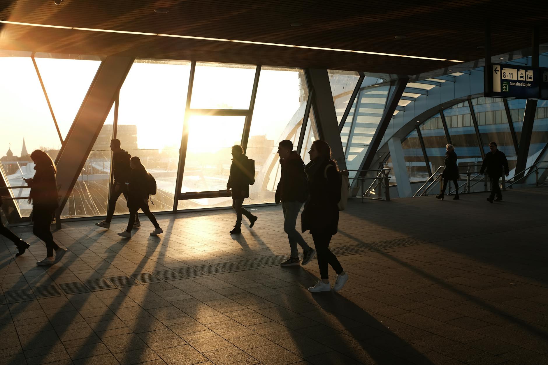 People walking through a busy urban transit area