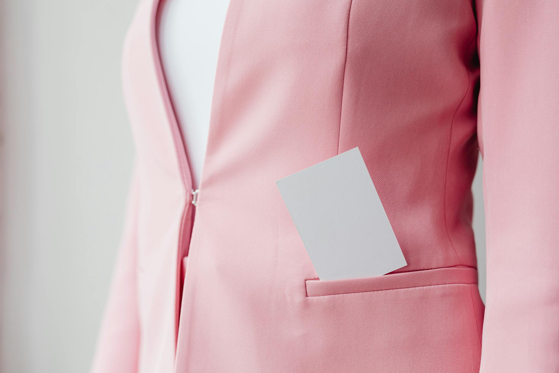 Close-up detail of high-end jacket showing intricate stitching and premium fabric texture