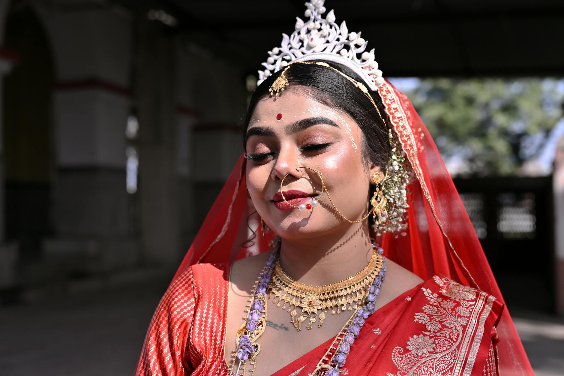 Bride getting professional makeup applied on wedding day