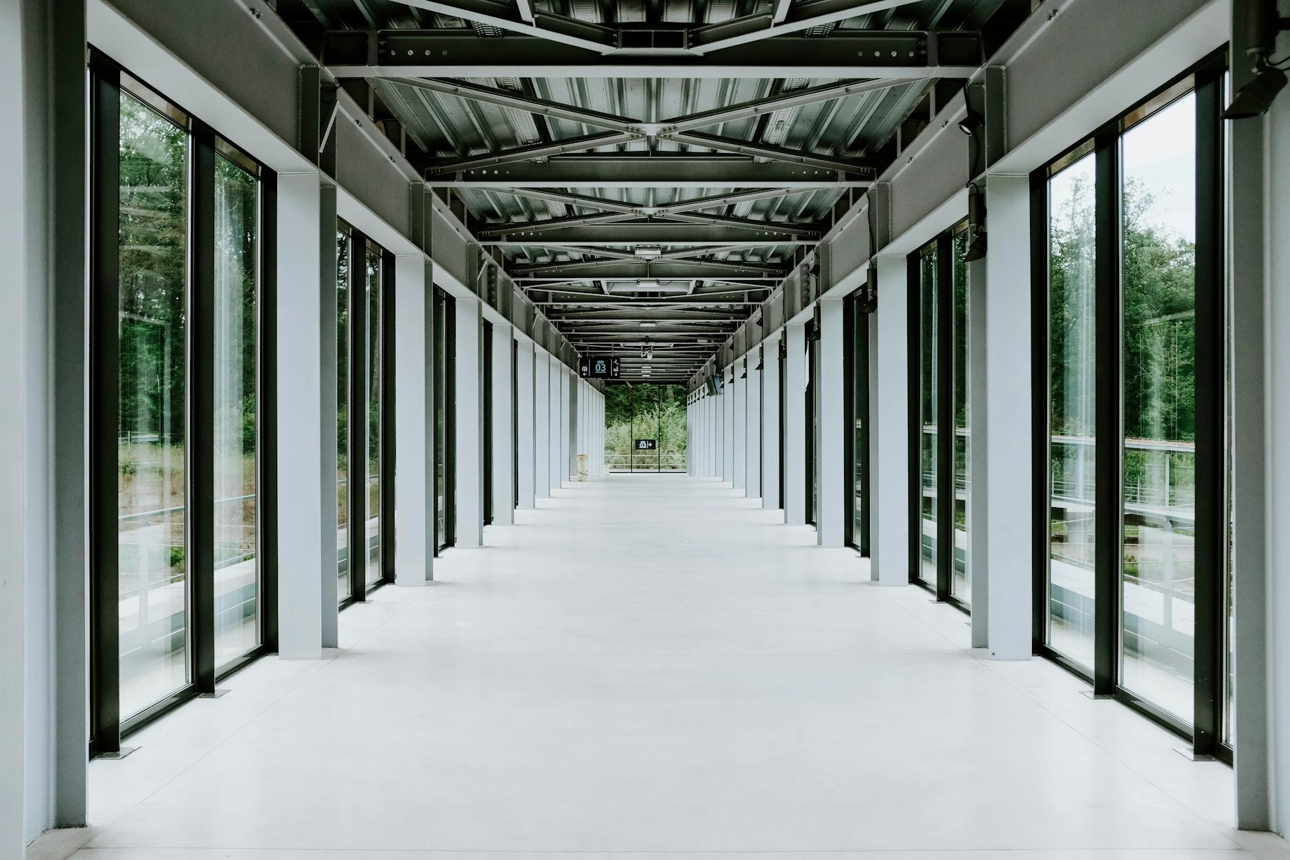 Modern corporate office hallway with professional footwear visible