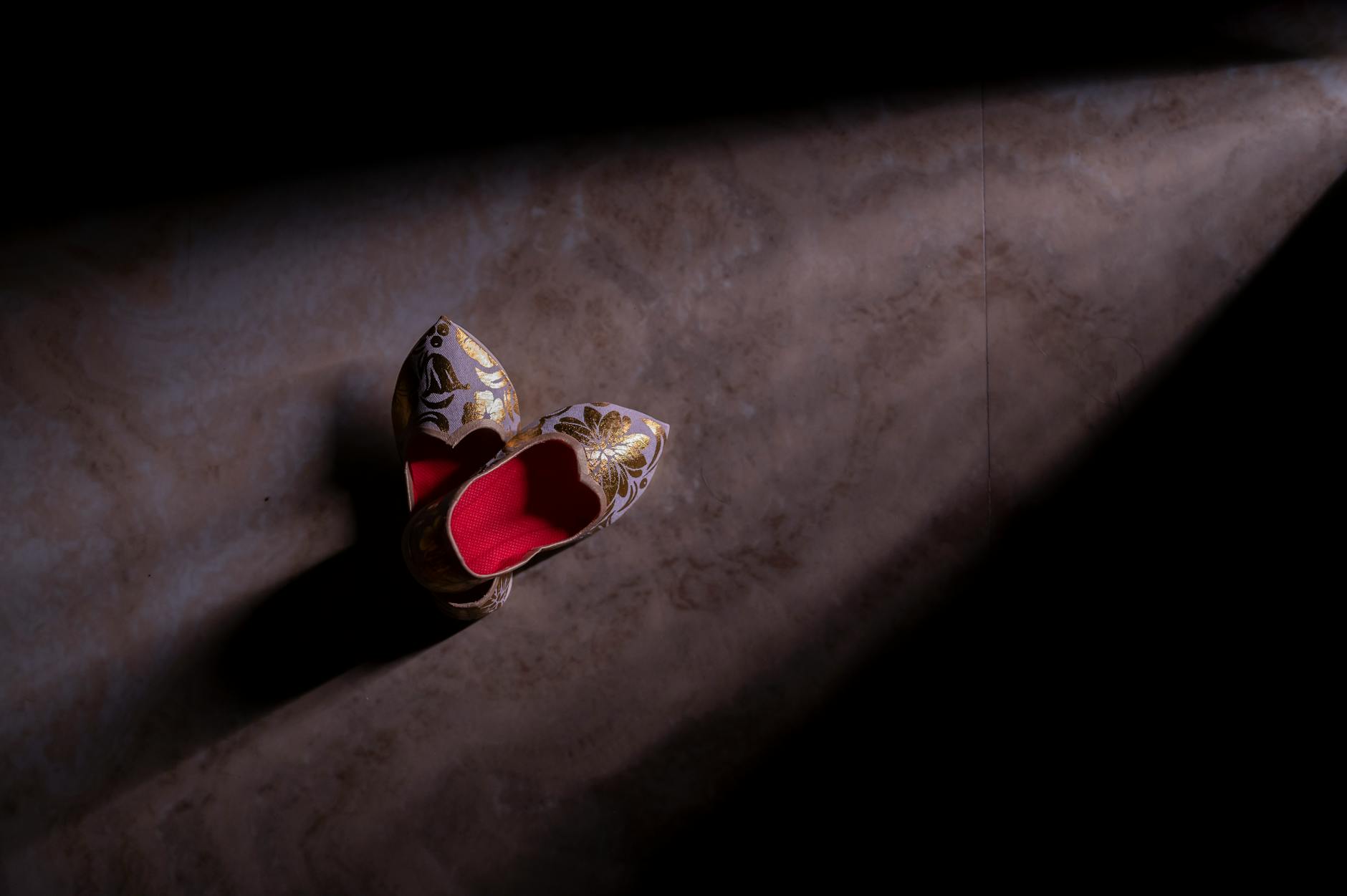 Stylish black designer shoes displayed on clean surface