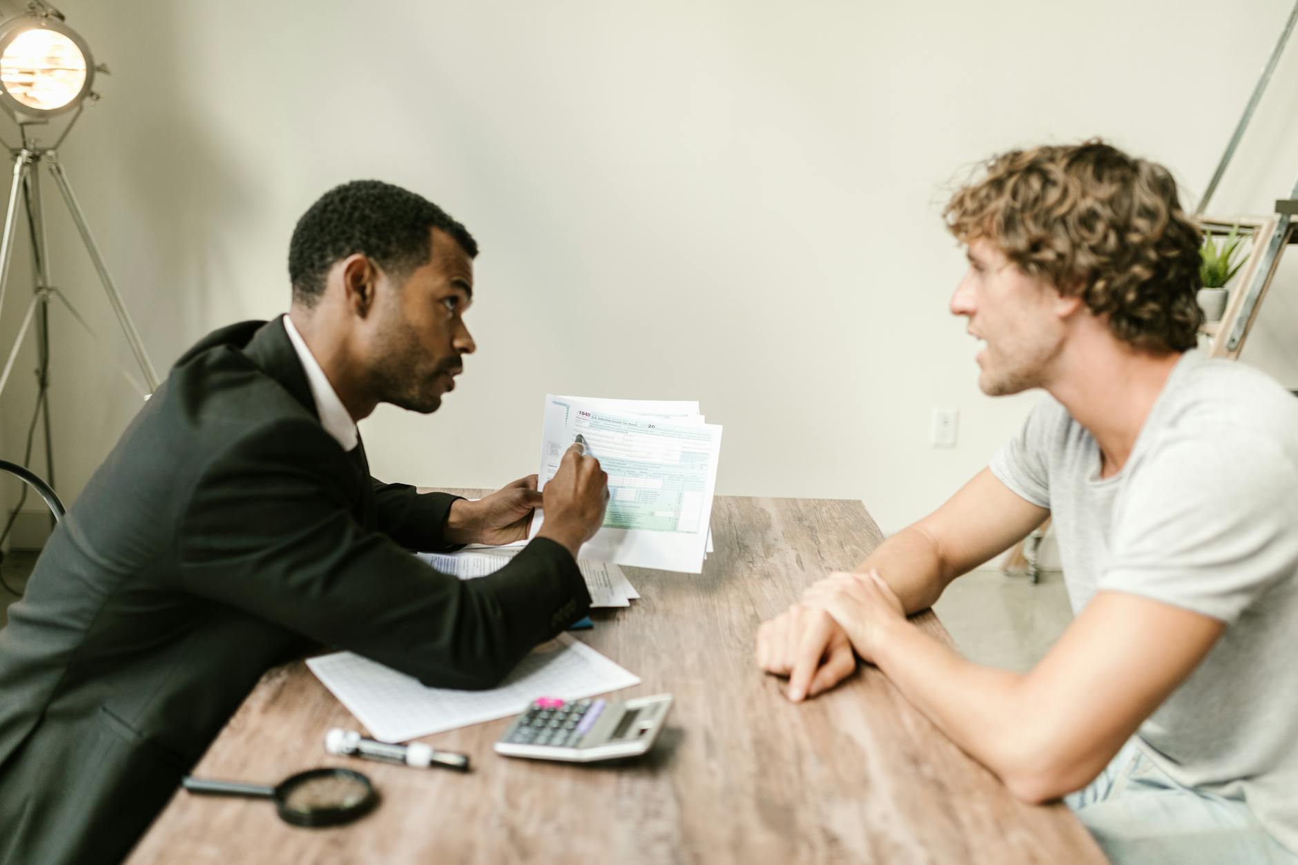 Professional consultant working with client at modern office desk