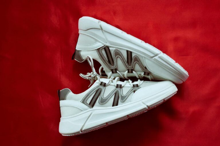 Close-up of classic white leather sneakers showing clean minimalist design