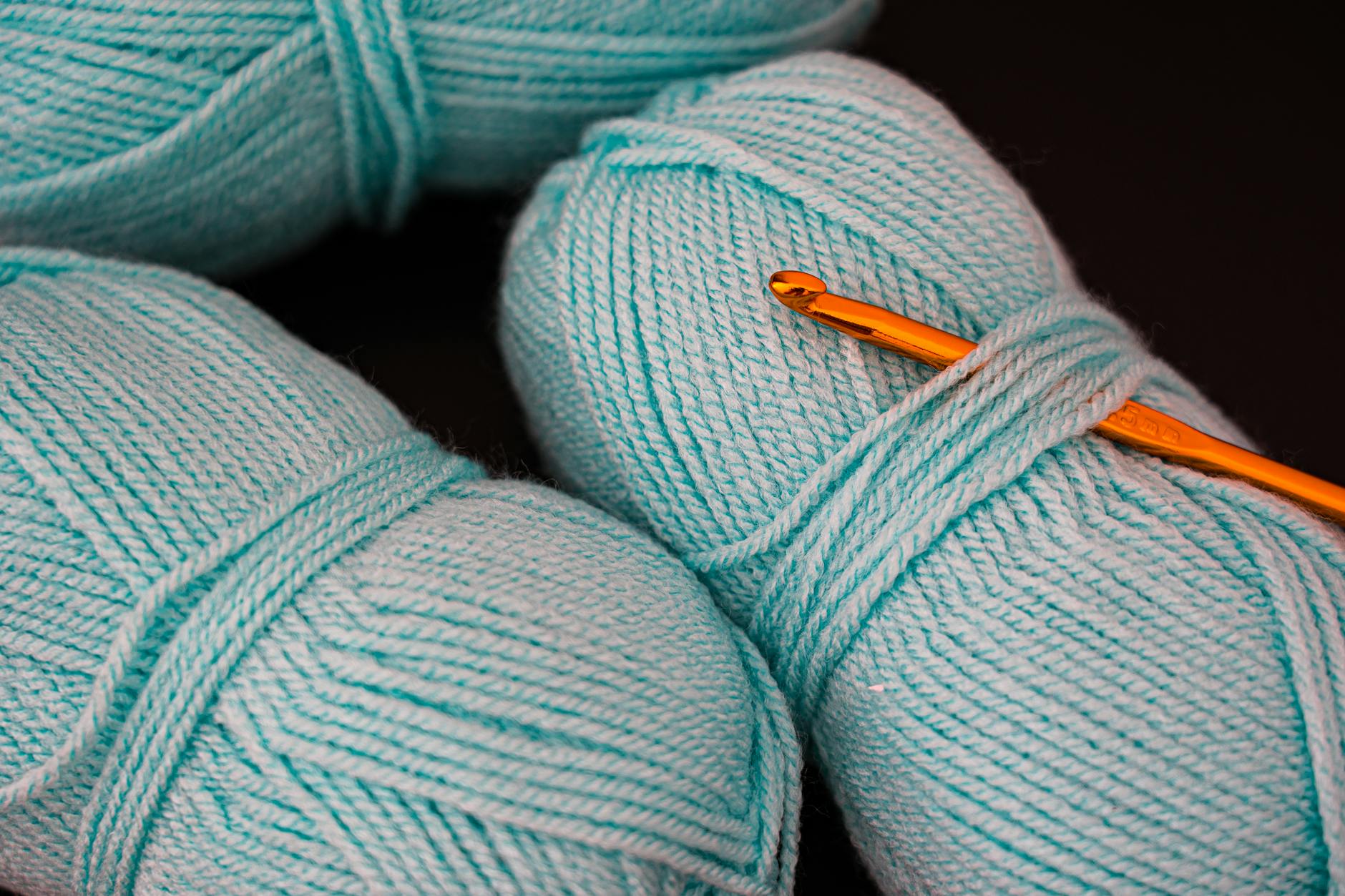 Close-up view of intricate crochet textile work showing detailed stitching patterns