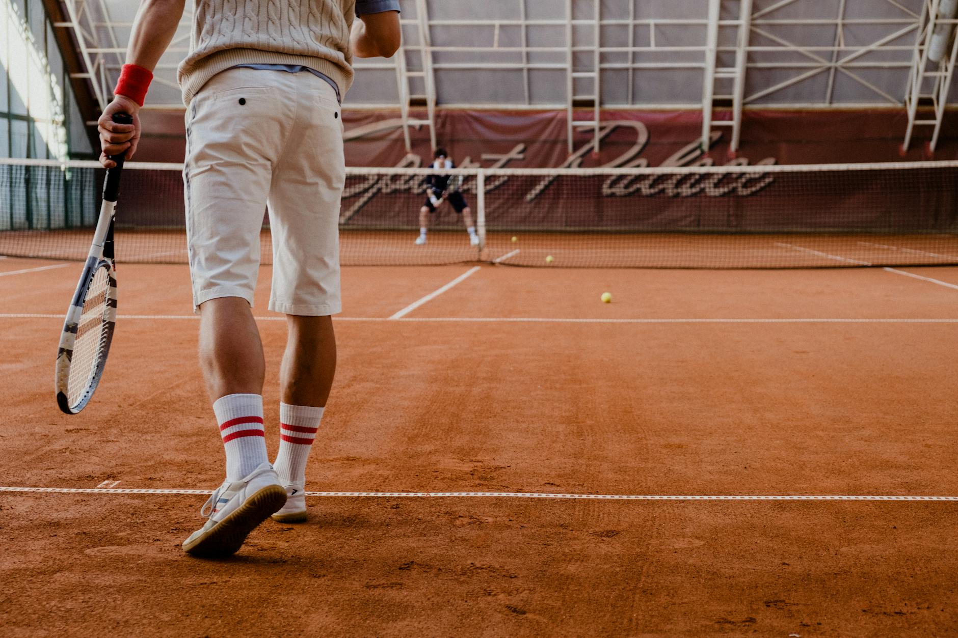 White athletic shoes on tennis court surface highlighting sporty heritage