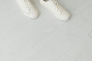 Todd Snyder and Sperry Tap Mister Rogers for a Three-Piece Drop White canvas low-top sneakers on a clean surface