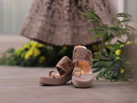 High-end designer sandals displaying innovative heel construction and artistic design elements