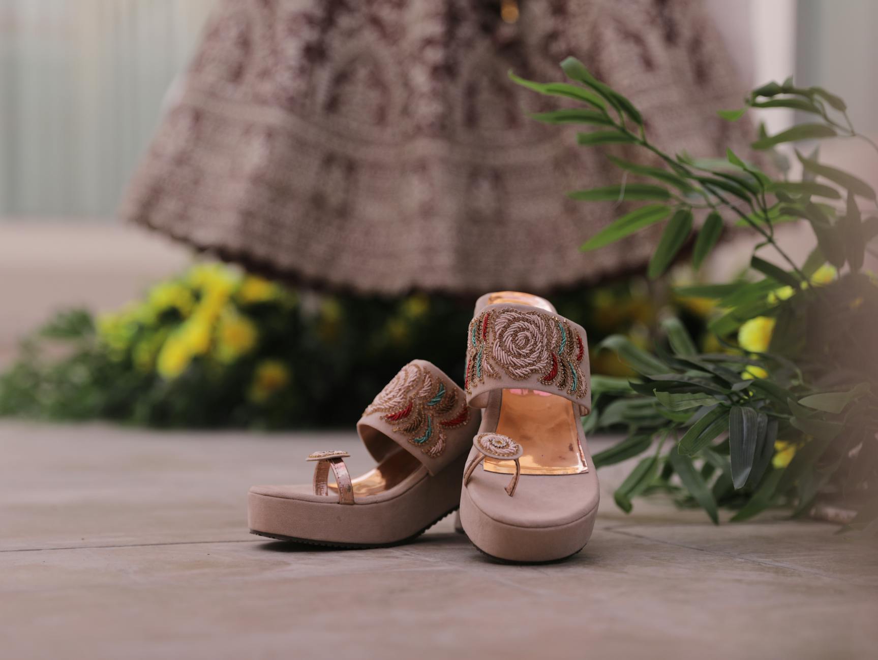 High-end designer sandals displaying innovative heel construction and artistic design elements