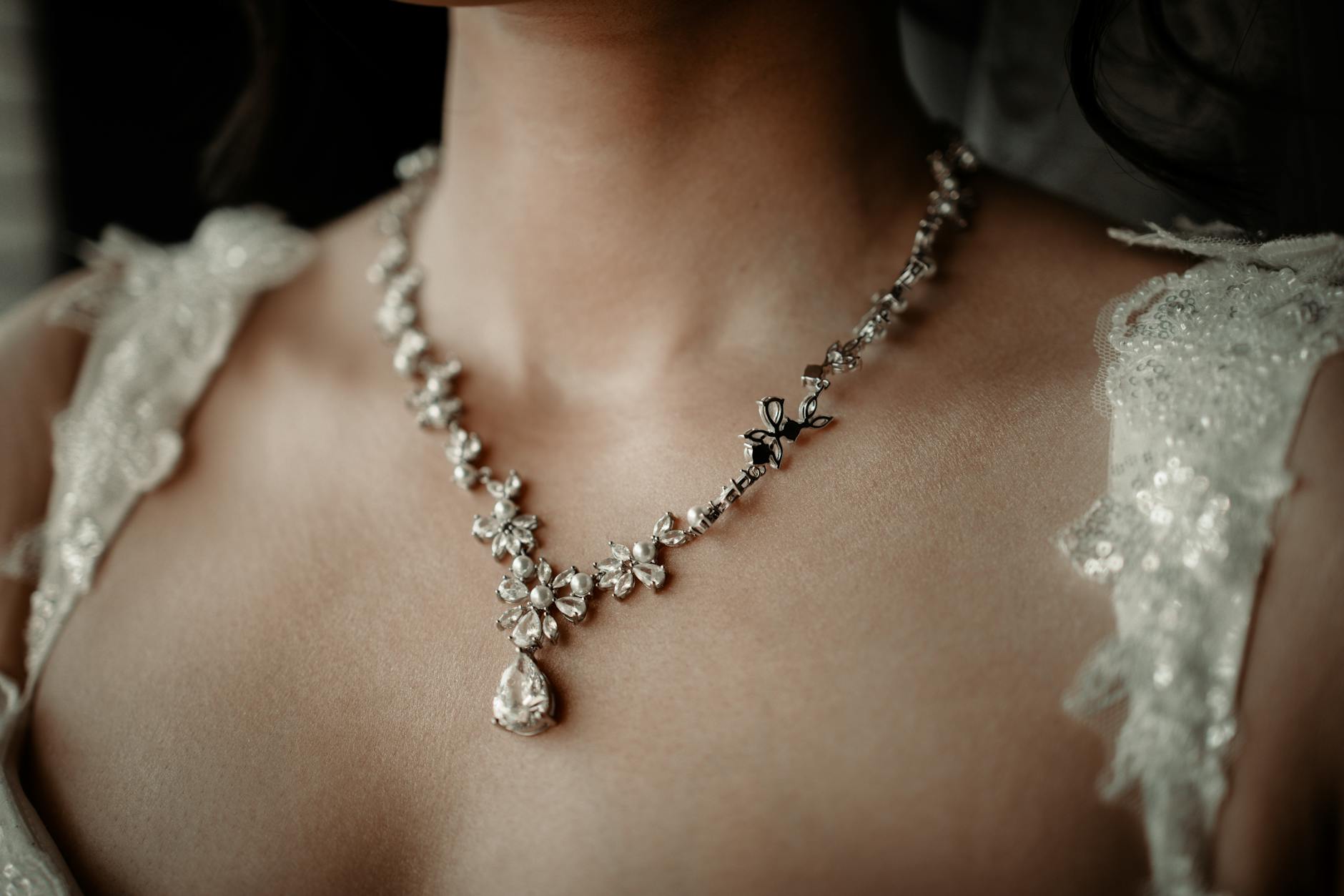 Close-up of Swarovski crystals catching light on model's face